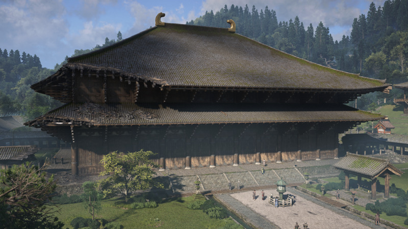 A screenshot taken looking at the Daibutsuden hall in Ubisoft's Assassin's Creed Shadows. The view focuses on the large wooden main hall of the Todai-ji temple complex during the day, showing the hall in a state of disrepair. 