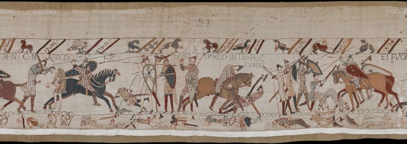 A screenshot of panel 57 of the Bayeux Tapestry. As the battle begins to die down, multiple figures are depicted dead or dying. With few horses remaining, the last of the fighting occurs largely on foot, with axes and spears.