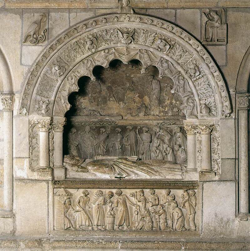 Tomb of Bishop Martín II Rodriguez decorated with relief sculptures in stone of angels and other mourning figures. 
