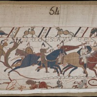A screenshot of panel 54 of the Bayeux Tapestry. Figures on and off of horseback clash in battle. The central figure, Bishop Odo of Bayeux, wields a club. 