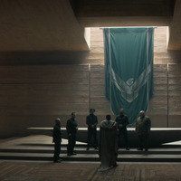 Dark room serving as the Atreides command center. Figures of high status stand and a large Atreides banner decorates the wall.