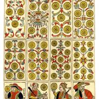 14 printed coin suit cards lay in front of a yellow background 
