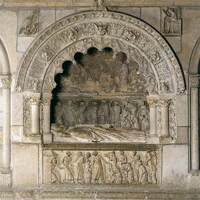 Tomb of Bishop Martín II Rodriguez decorated with relief sculptures in stone of angels and other mourning figures. 
